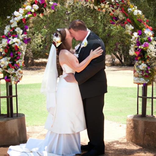Cặp đôi mới cưới chia sẻ nụ hôn dưới một cánh đồng hoa tuyệt đẹp.